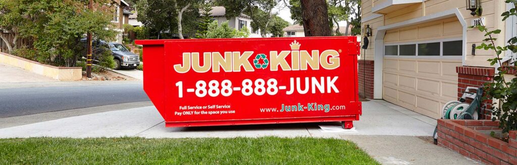 junk removal dumpster in the driveway of an apex nc home
